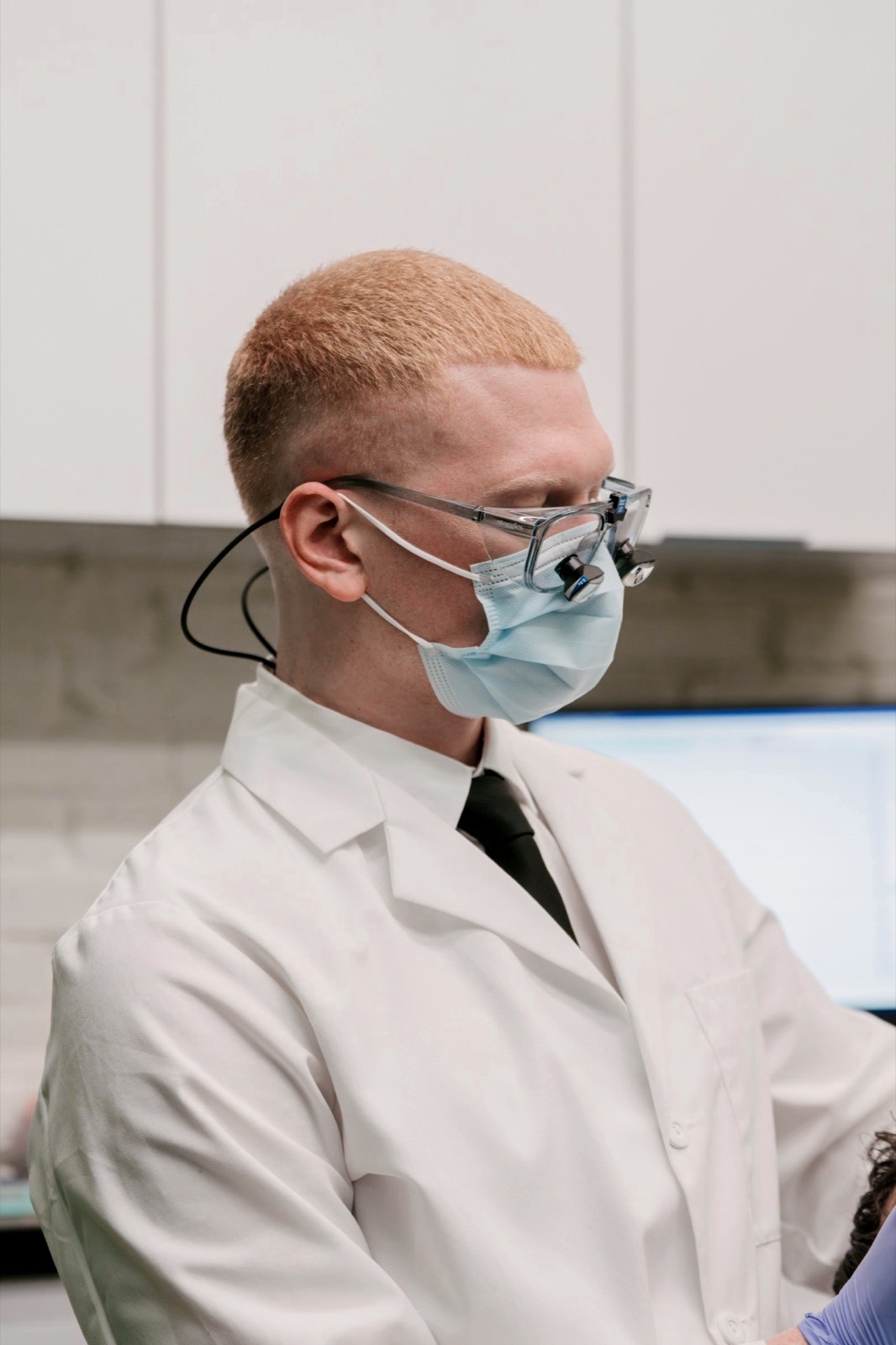 Dr. Colby in his loupes, reviewing a patient’s images