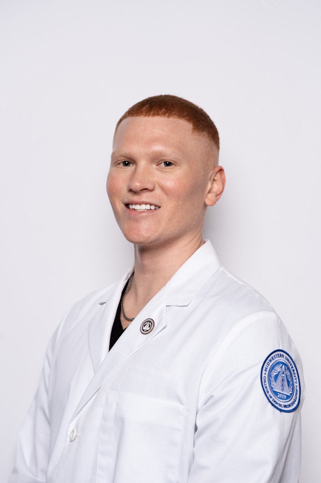 Dr. Colby in his white coat