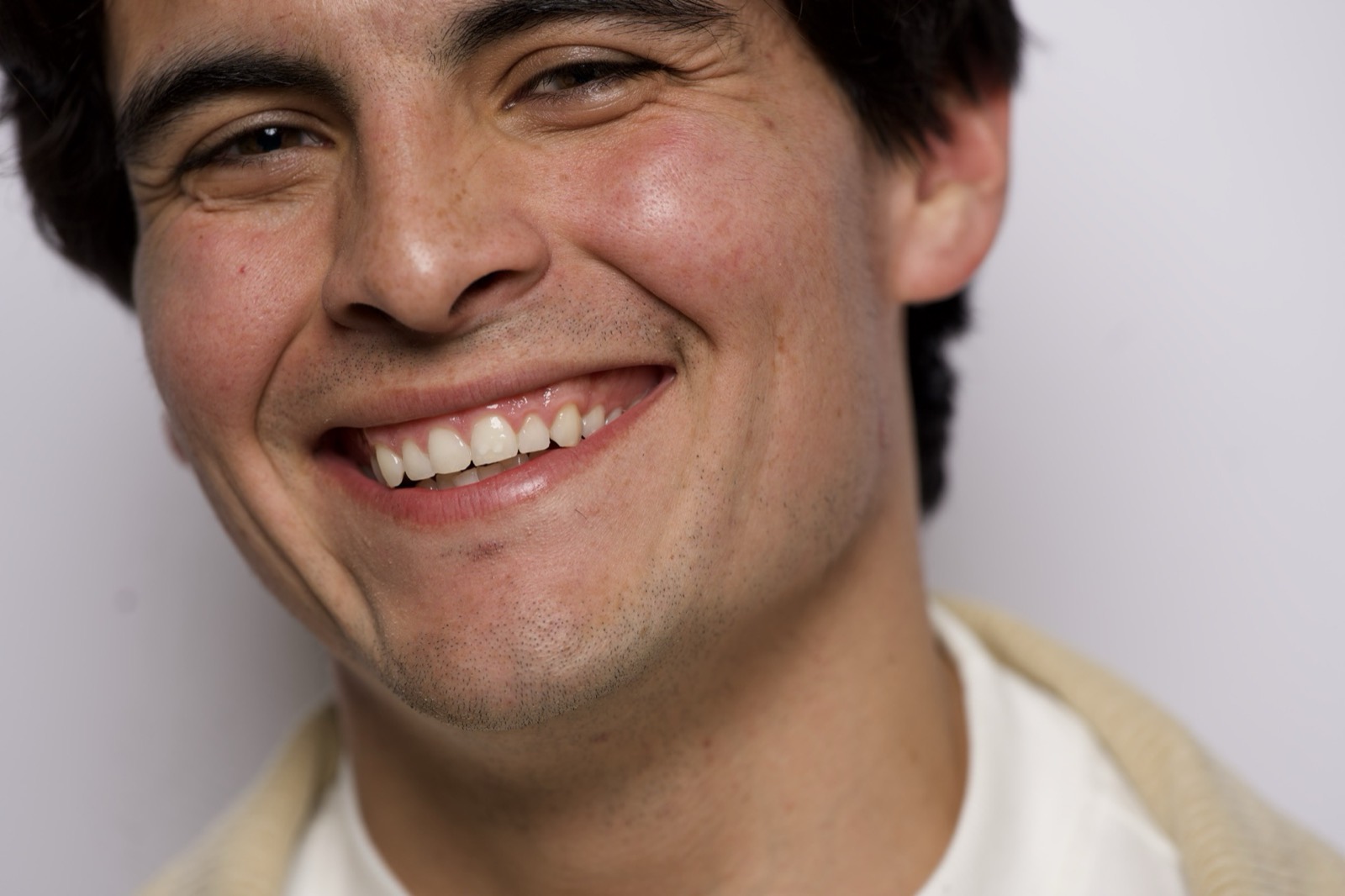 A man smiling, close up