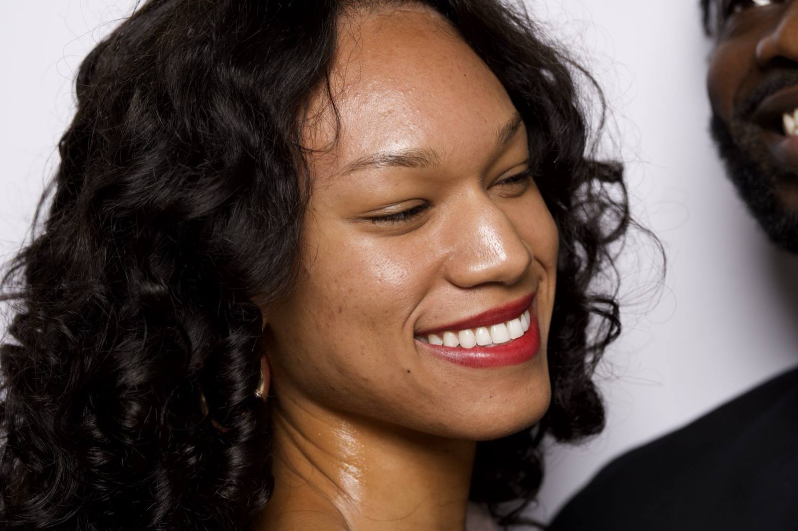 A woman smiling in warm light